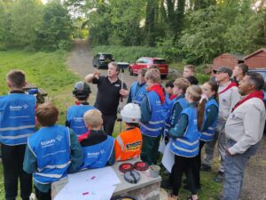 Stuart Gilling from Malcolm Hughes visits Scout field Peckmill wood to give hands on survey activity